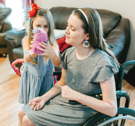 Woman in wheelchair with daughter